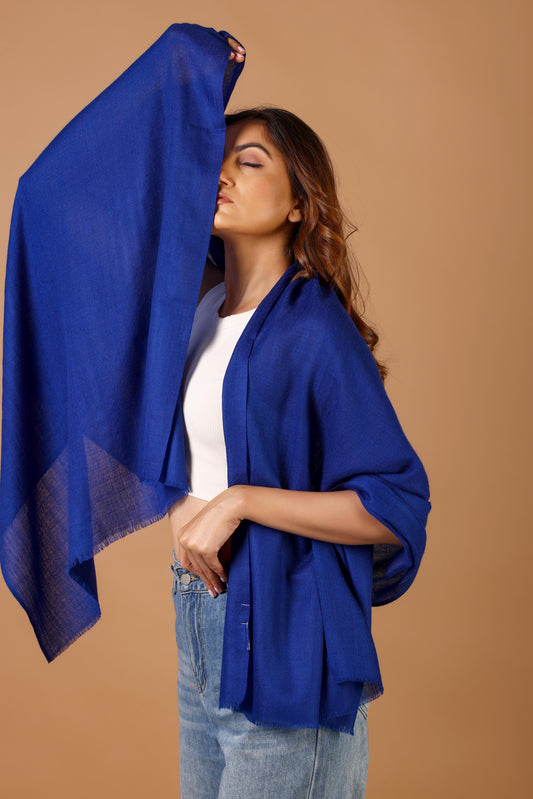 Woman wearing a blue shawl