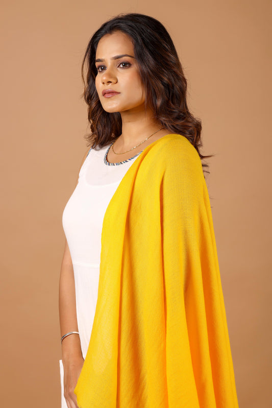 Woman wearing a yellow shawl