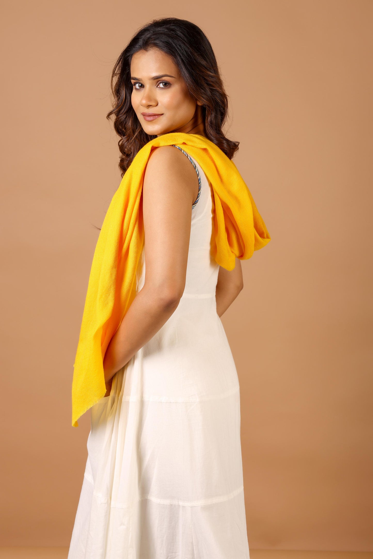 Woman wearing a yellow scarf