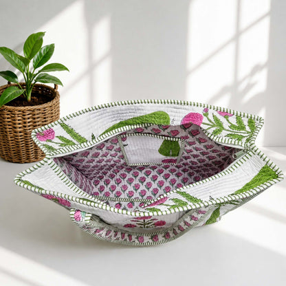 Decorative woven basket with floral pattern on a white surface