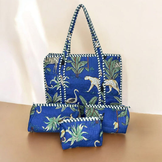Blue floral-patterned tote bag with matching pouch on a beige surface