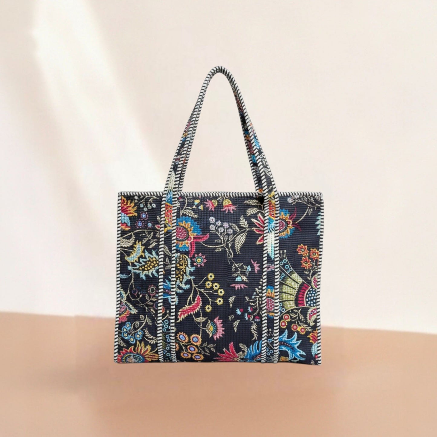 Floral patterned tote bag on a beige background