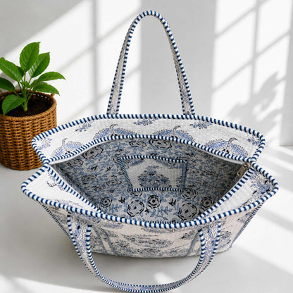 Decorative tote bag with blue and white pattern on a light background