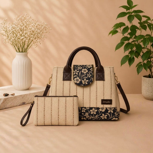Two handbags on a beige surface with a vase and plant in the background
