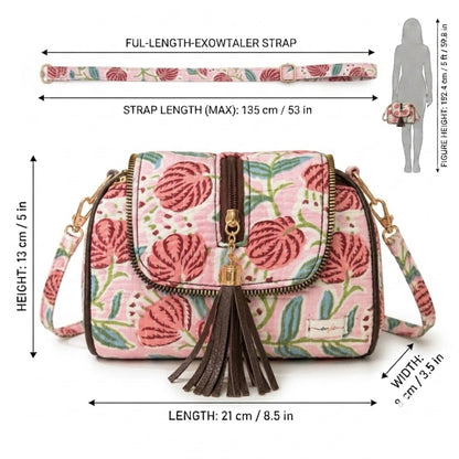 Handcrafted sling bag features a vibrant pink floral pattern | OMVAI